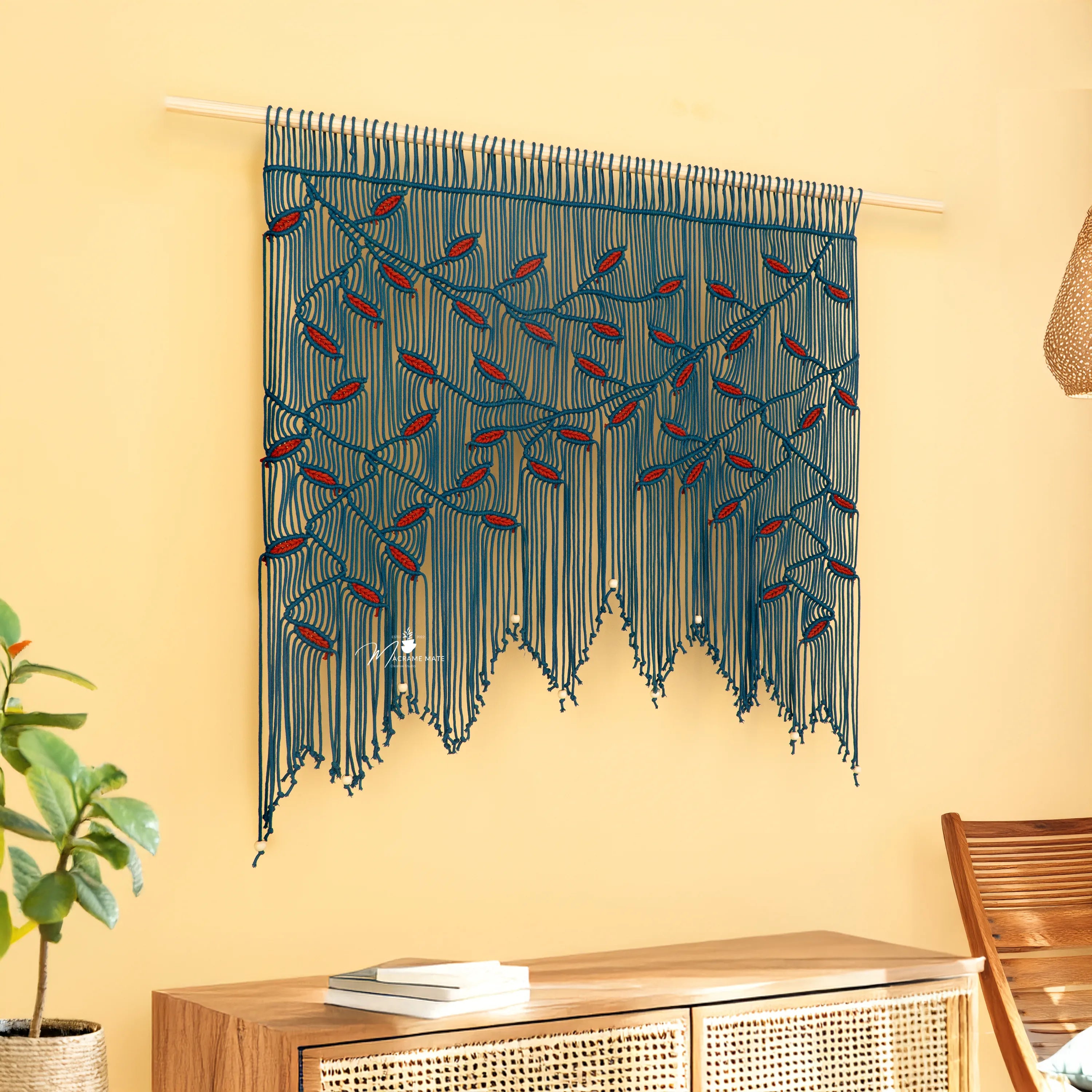 Decorative wall hanging with blue and red pattern on a yellow wall