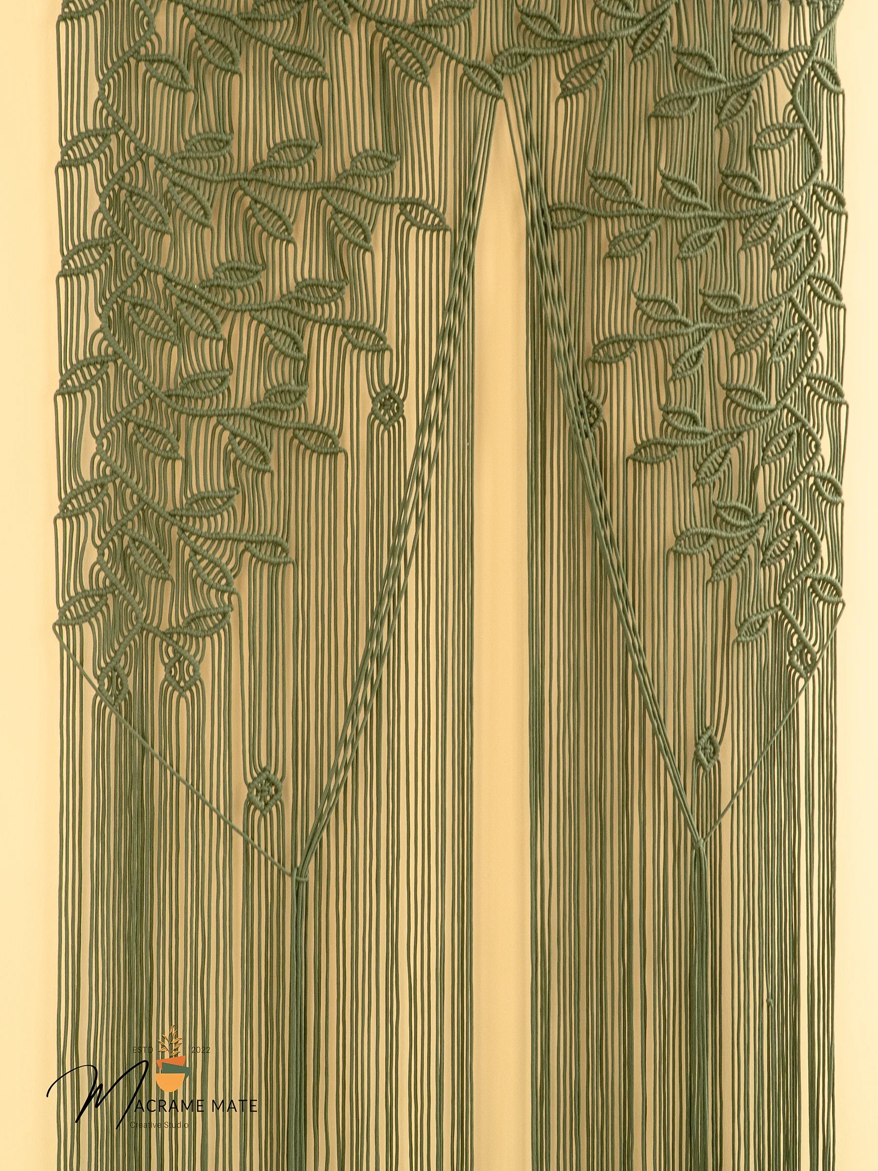 Decorative design with vertical lines and leaf patterns on a beige background