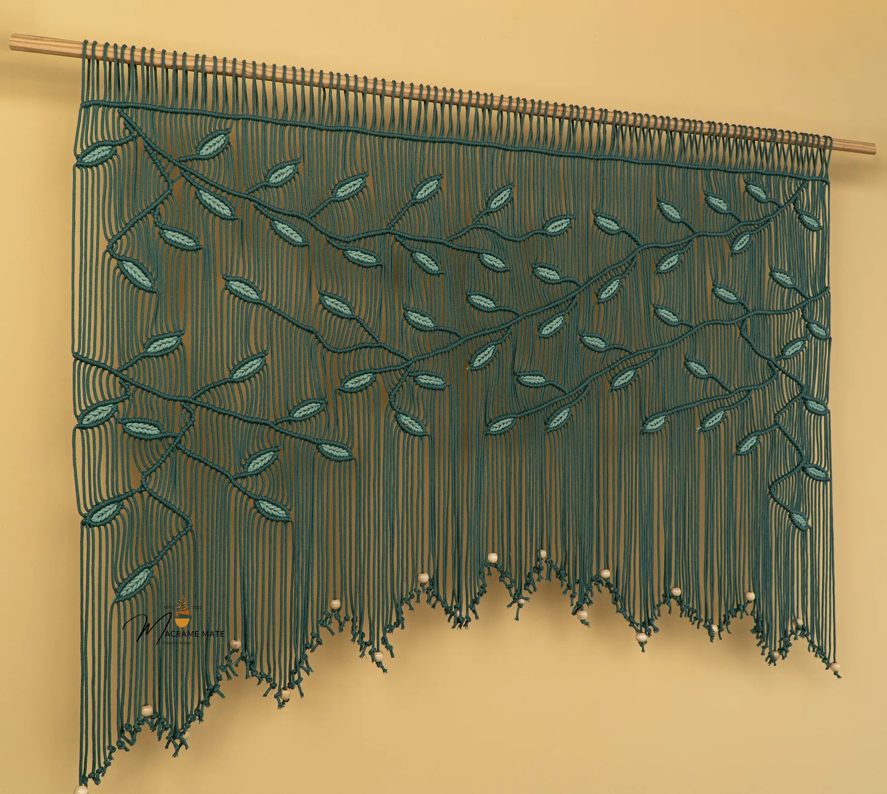 Decorative string curtain with leaf pattern on a beige background
