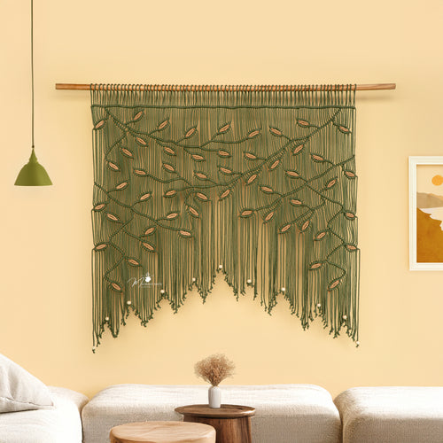 Decorative wall hanging with green and brown pattern in a living room setting.