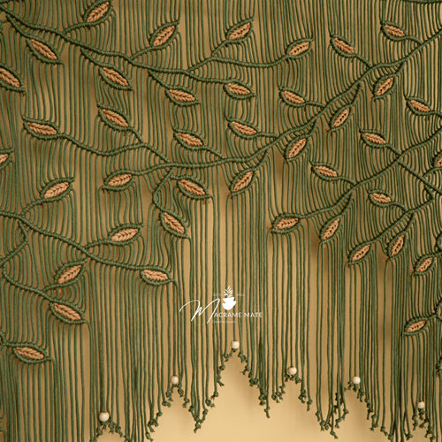 Close-up of a green embroidered fabric with a brand logo in the corner.