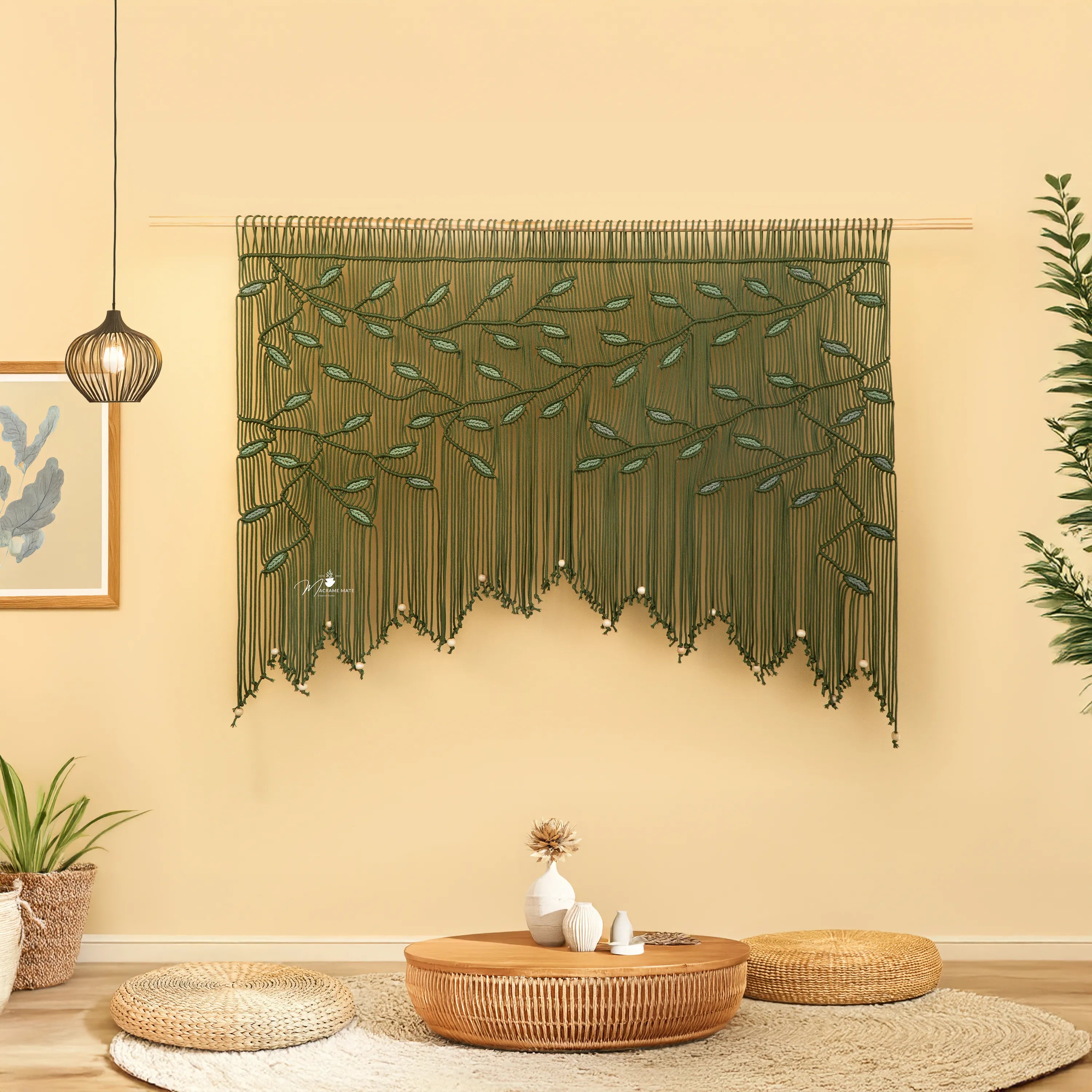 Decorative wall hanging with leaf pattern in a room with a coffee table and plants.