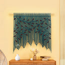 Decorative string art with leaf patterns on a yellow wall above a wooden console table.