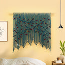Decorative wall hanging with blue and red strings on a yellow wall.