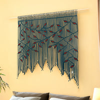 Macrame wall hanging with geometric pattern on a beige wall