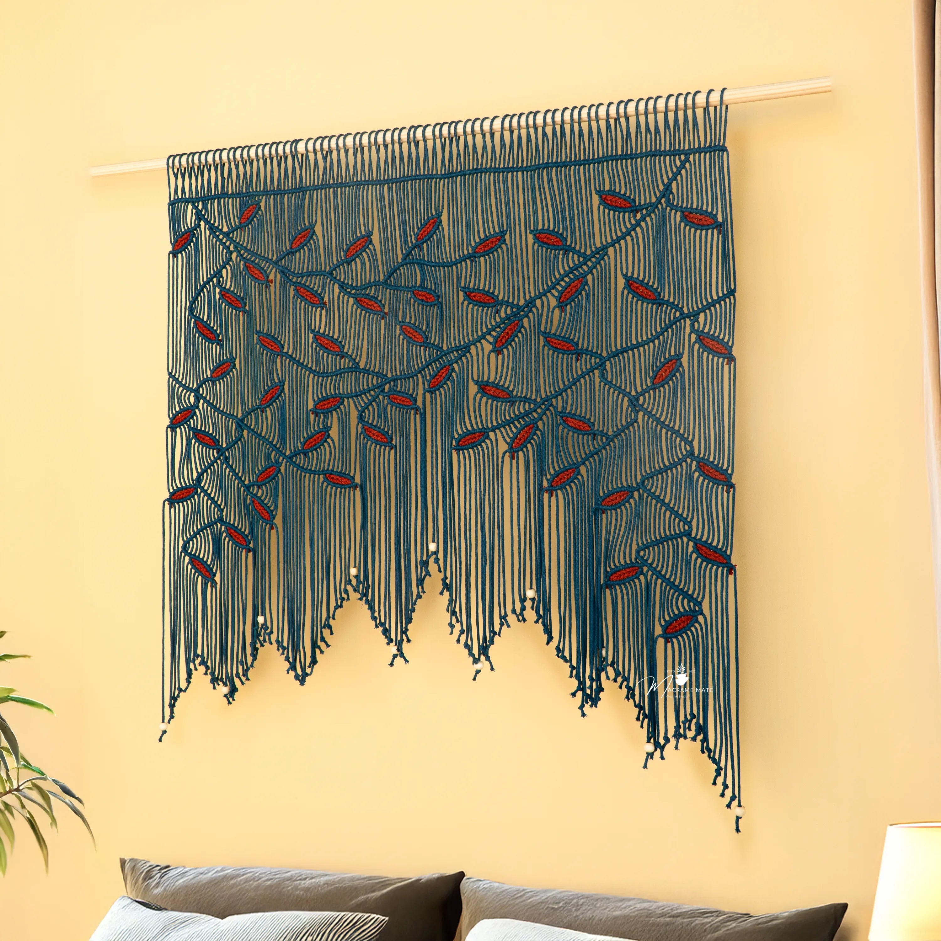Macrame wall hanging with geometric pattern on a beige wall