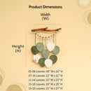 Decorative wall hanging with leaf elements and measurement chart on a beige background