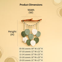 Decorative wall hanging with leaf elements and measurement chart on a beige background