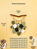 Decorative wall hanging with leaves and measurements on a beige background