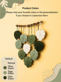 Decorative wall hanging with leaf-shaped ornaments on a yellow background