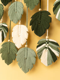 Decorative leaf-shaped tassels on a yellow background