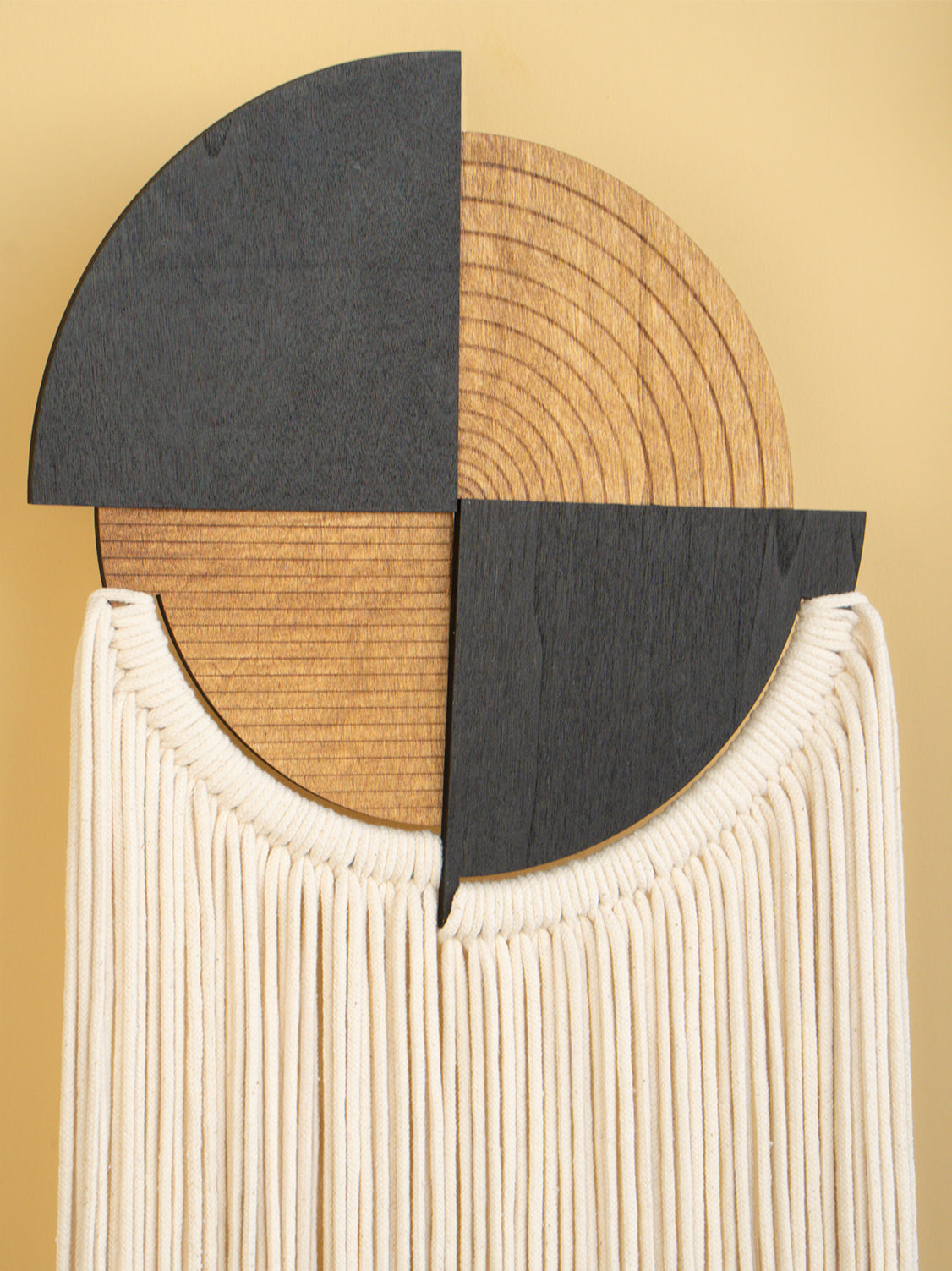 Decorative wall piece with geometric design on a beige background
