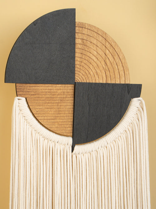 Decorative wall piece with geometric design on a beige background