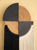 Decorative wall piece with geometric design on a beige background