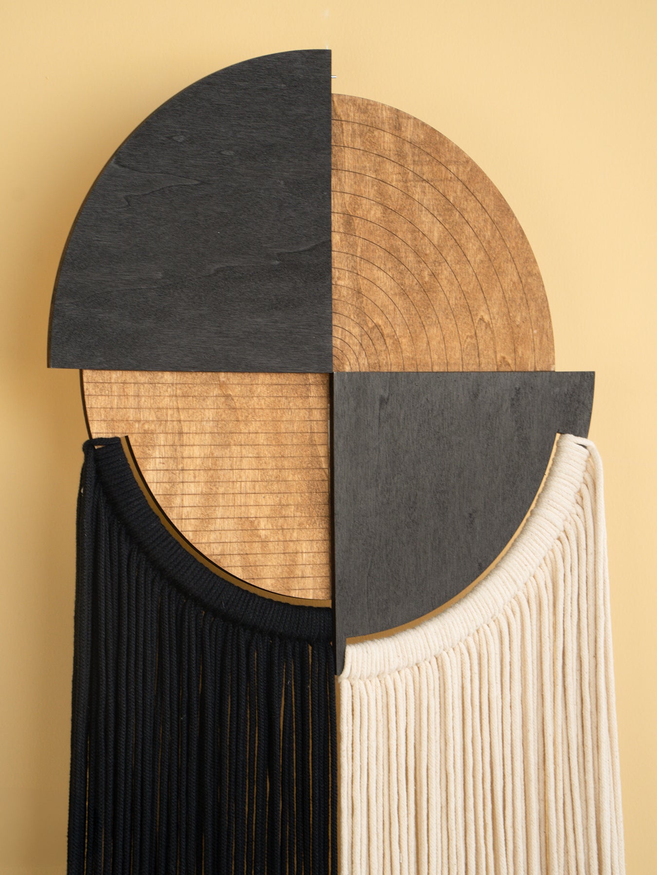 Decorative wall piece with geometric design on a beige background