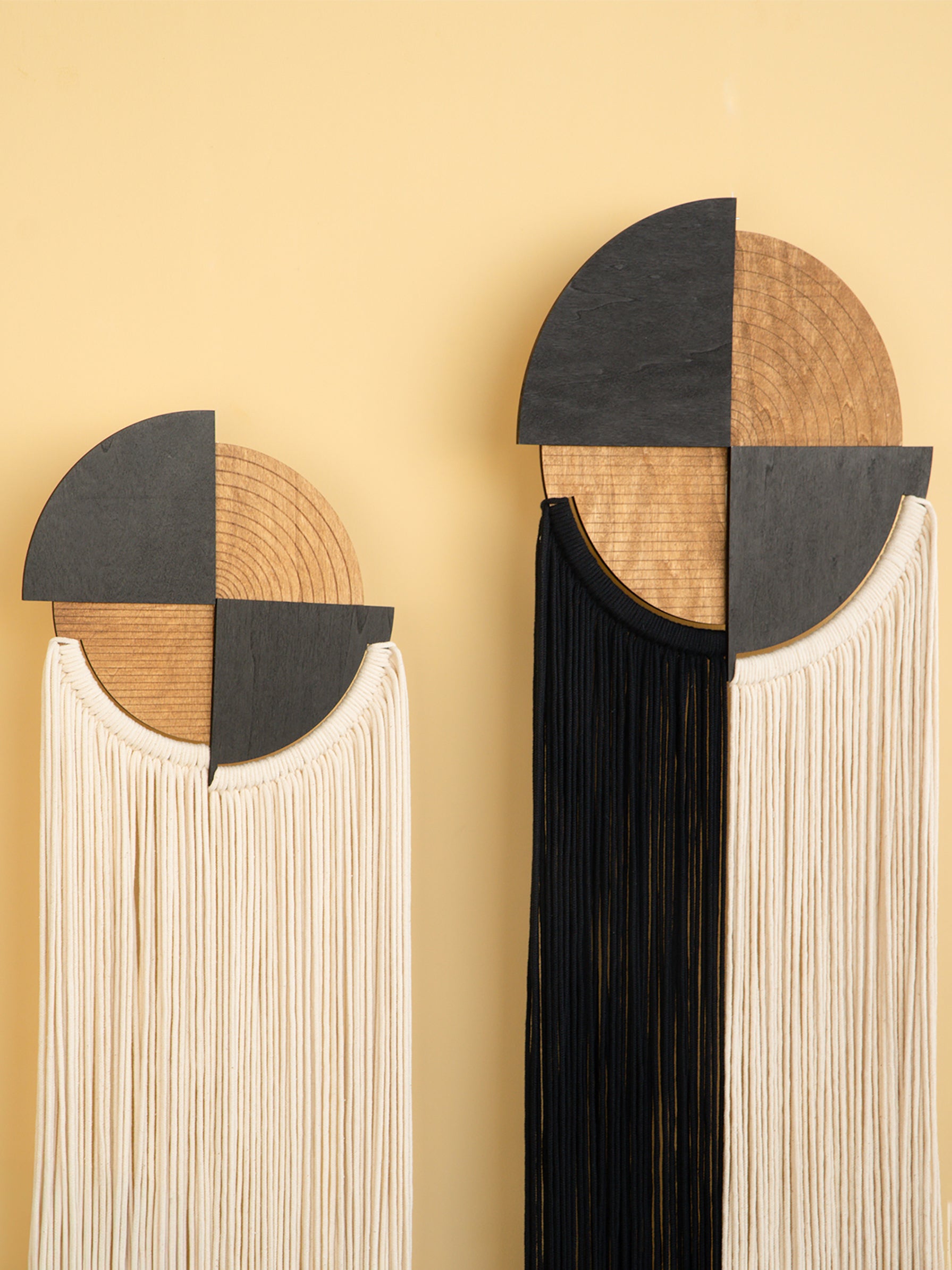 Decorative wall art with geometric design on a yellow background