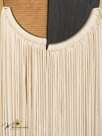 Fiber wall hanging crafted from macrame perfect for contemporary spaces needing a stylish touch
