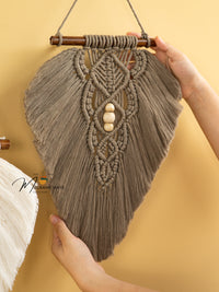 Handcrafted macrame leaf art, ideal for natural or simple spaces    
