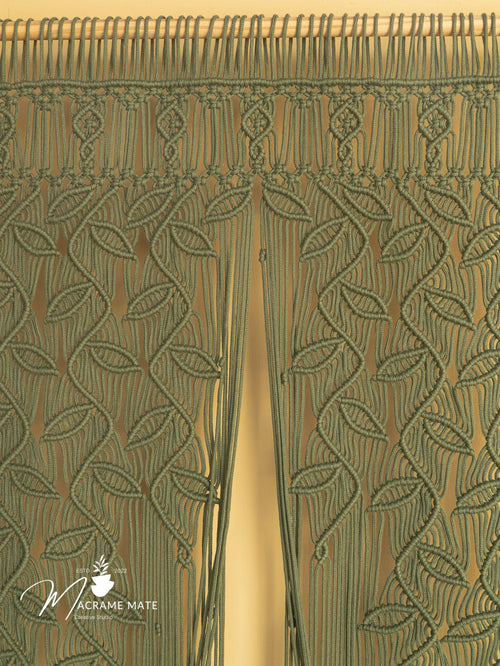 Close-up of a green woven fabric with a pattern, featuring the brand 'Macrame Mate'.