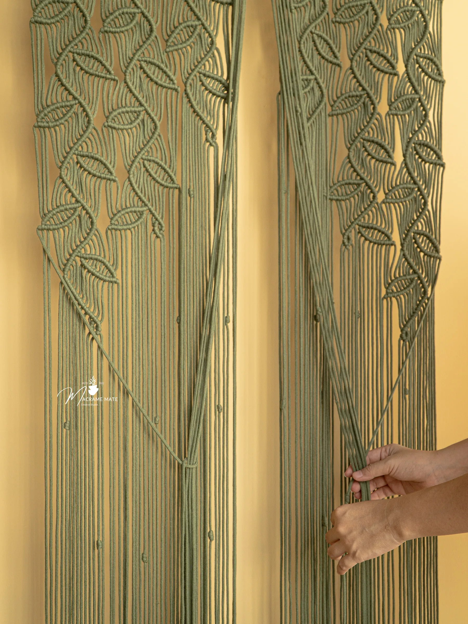 Decorative wall art with leaf patterns on a beige background