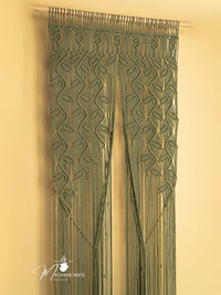Macrame door curtain with leaf pattern on a beige background, featuring the brand 'Macrame Mate'.