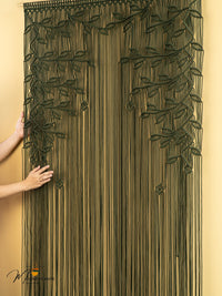 Decorative string door curtain with leaf patterns on a beige background