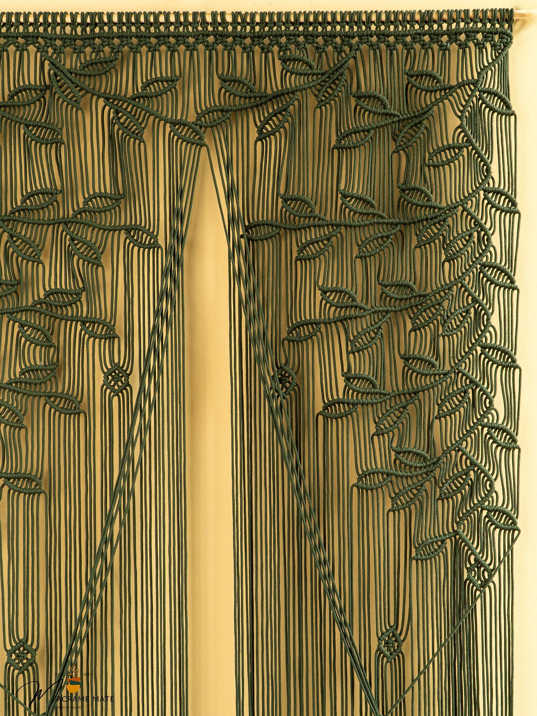 Decorative curtain with intricate leaf pattern on a beige background