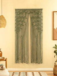 Textile wall hanging with leaf pattern on a beige wall