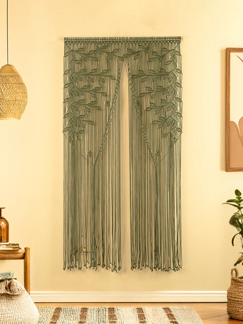 Textile wall hanging with leaf pattern on a beige wall