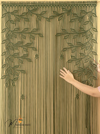 Textured curtain with leaf pattern and a hand touching it, brand 'Makromate' visible.