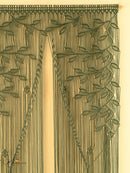 Decorative curtain with intricate leaf pattern on a beige background