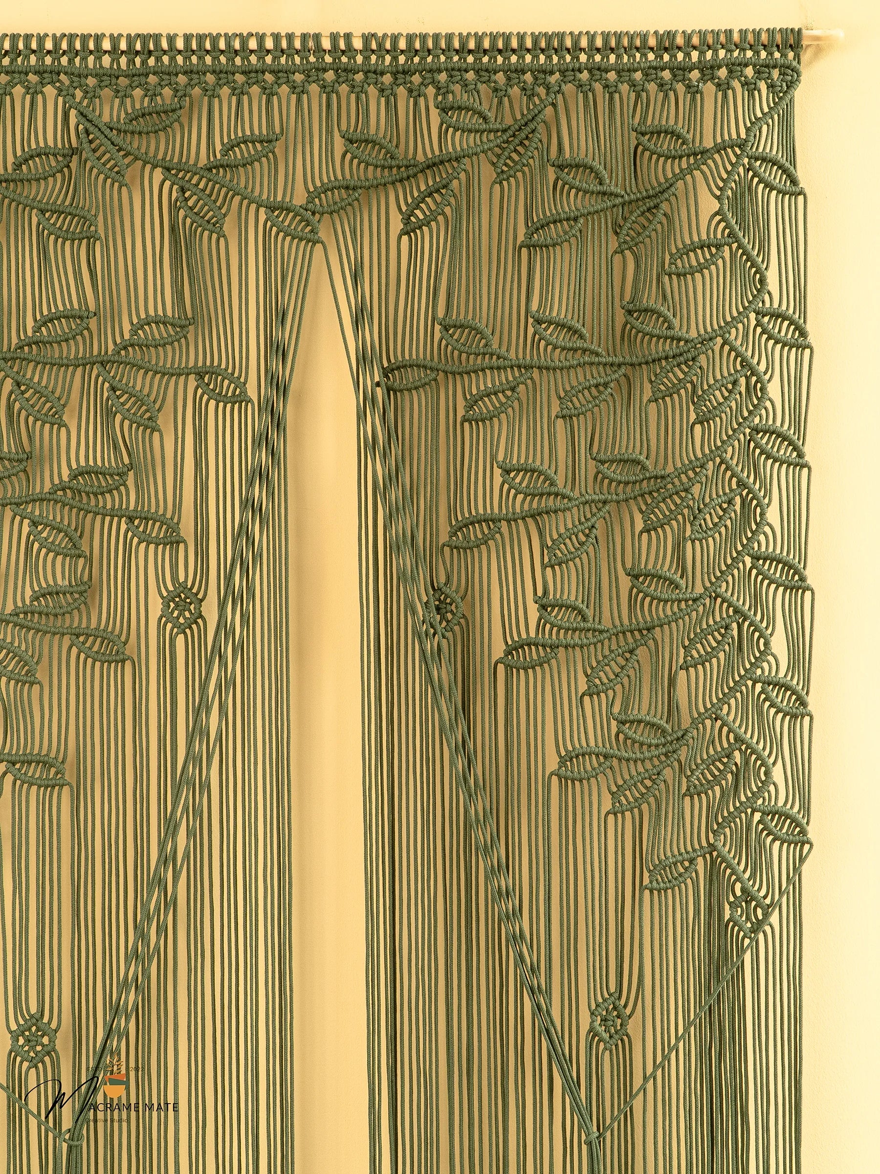 Decorative curtain with intricate leaf pattern on a beige background