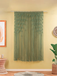 String curtain hanging on a wall with a yellow background