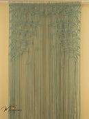Decorative string curtain with leaf pattern on a beige background