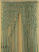 Decorative green curtain with leaf pattern on a beige background
