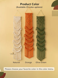 Three macrame wall hangings in natural, orange, and olive green on a beige background.