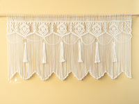 Handcrafted macrame curtain, perfect for minimalist or natural rooms 
