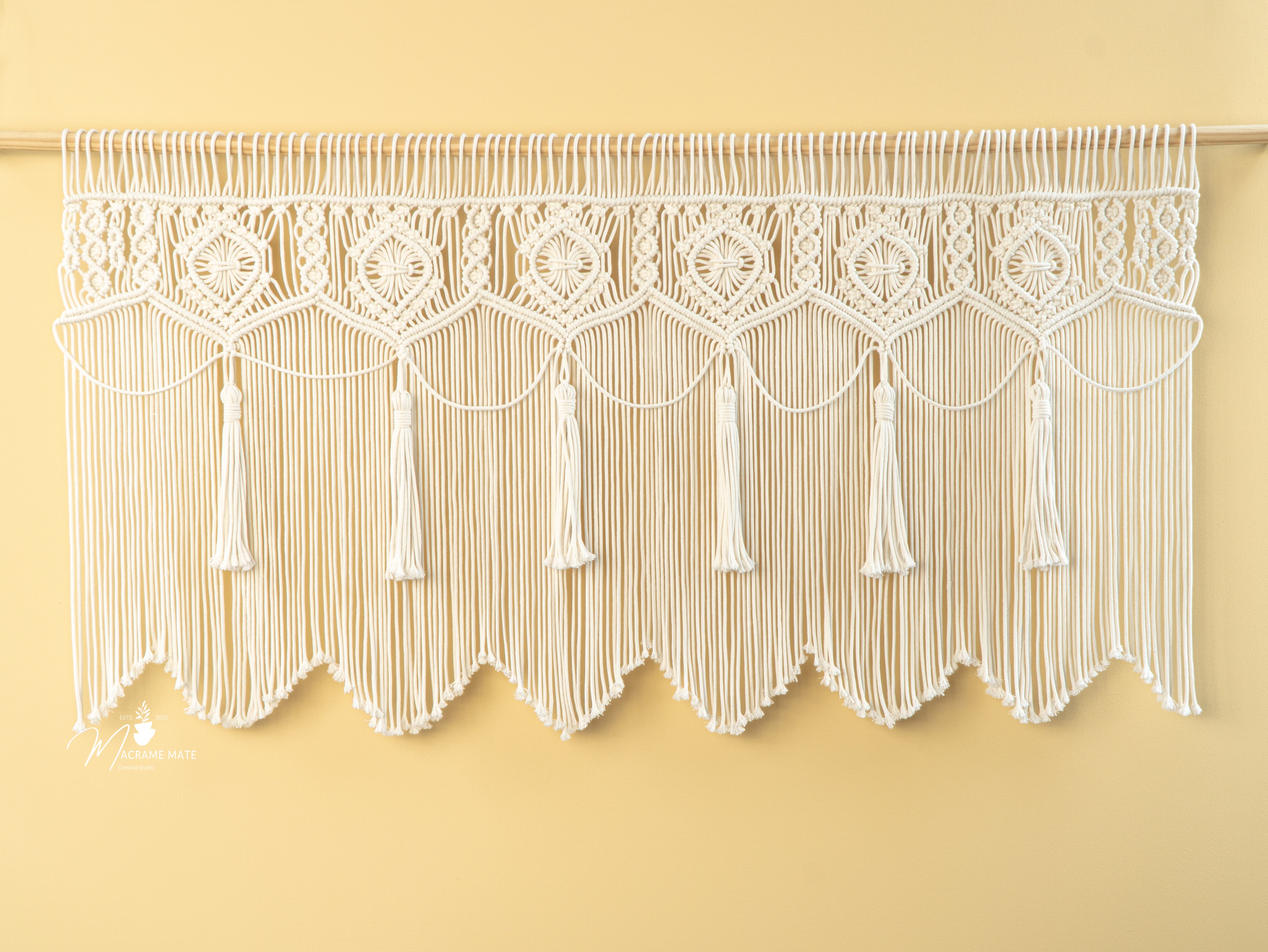 Handcrafted macrame curtain, perfect for minimalist or natural rooms 
