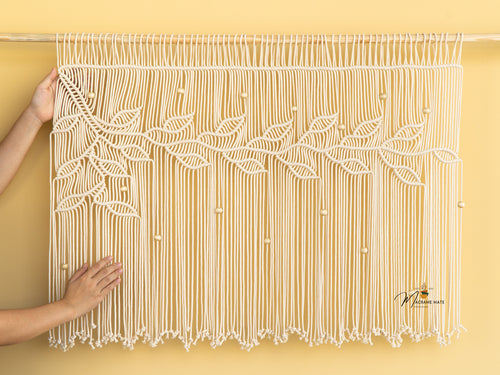 Boho macrame curtain, ideal for earthy or minimalist decor 

