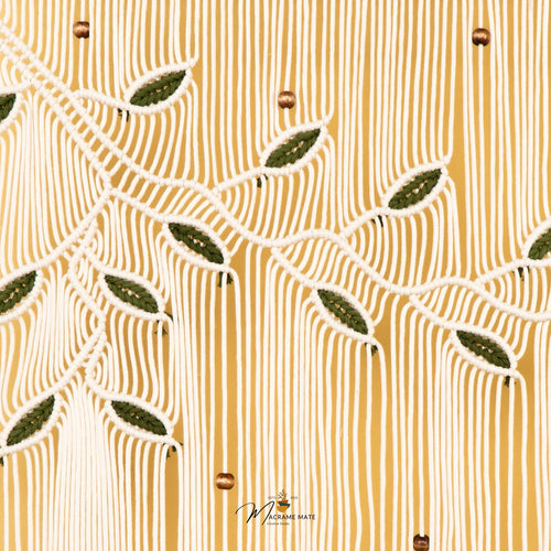 A close-up of a textured fabric featuring a warm mustard yellow background with vertical ribbed stripes and a cream-colored embroidered leaf pattern.