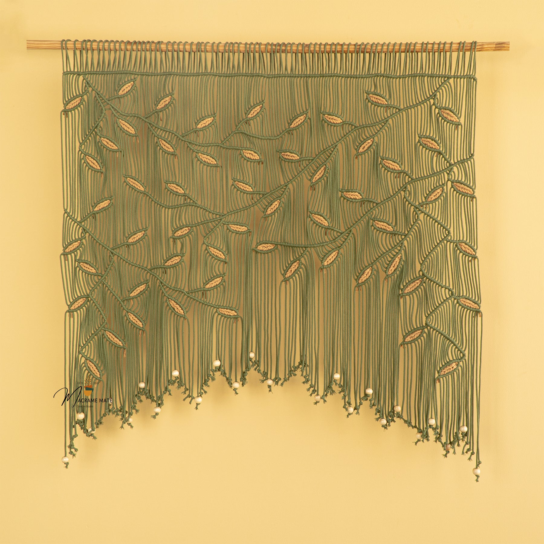 Elegant macrame curtain, ideal for minimalist or contemporary decor 
