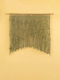 Elegant macrame curtain, ideal for minimalist or contemporary decor 
