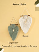 Two macrame wall hangings, one green and one white, on a beige background.