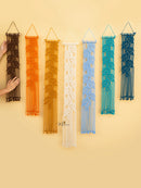 Set of six woven wall art pieces in various colors on a yellow background