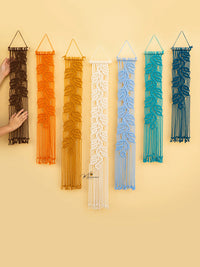 Set of six woven wall art pieces in various colors on a yellow background