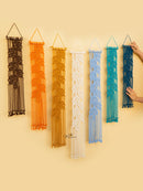 Set of six macrame wall hangings in various colors on a beige background