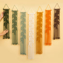 Set of seven narrow leaf vine macrame wall hangings displayed in botanical green and warm earth tone gradients