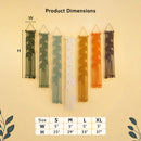 Earthy macrame wall hangings featuring forest green, olive, sage, off-white, mustard yellow, terracotta, and dark brown