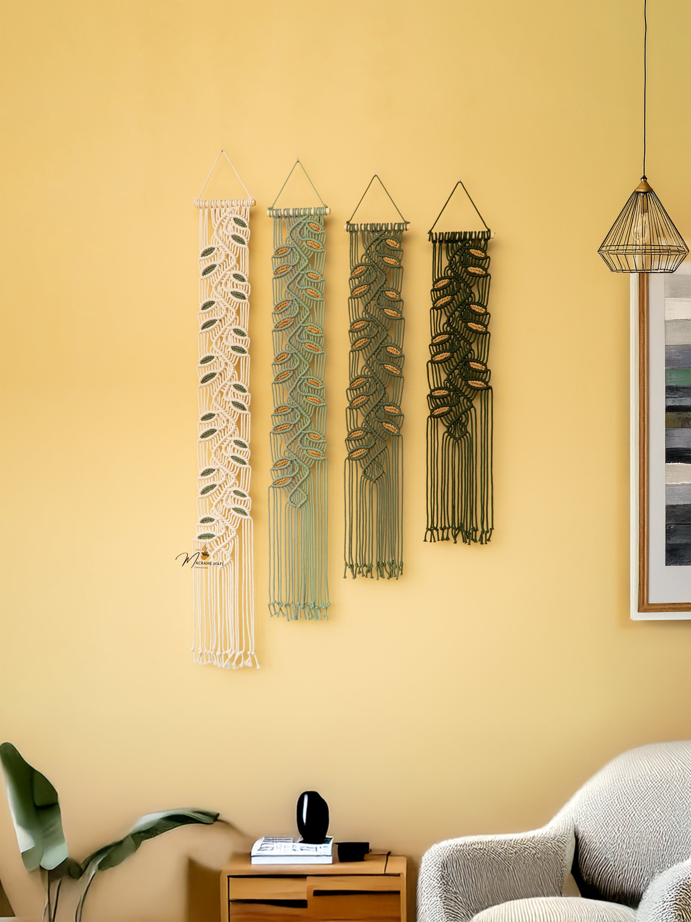 Decorative wall hangings on a yellow wall with a modern interior setting.